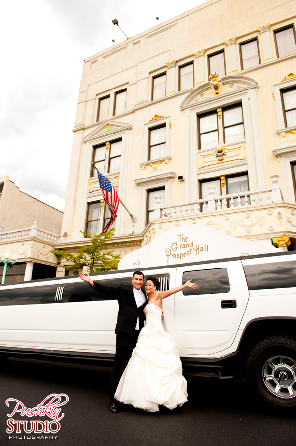 Bride and Groom posing for a photographe before the wedding